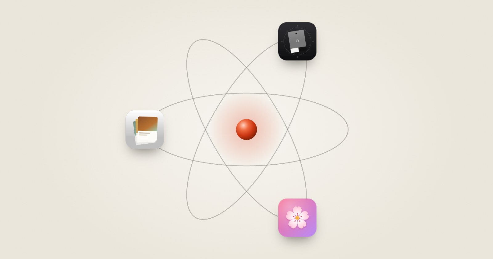 The studio's atom: a red point at the center of three orbits, with the Pressbook, Graycard and Fia icons on them.